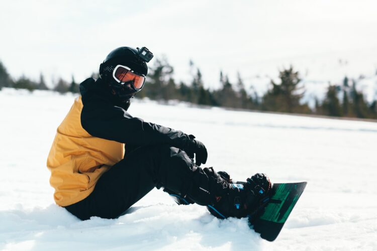 snowboarding man in yellow layers